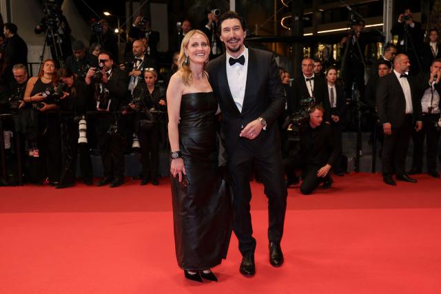 Us actor Adam Driver and his wife, actress Joanne Tucker, leave after the screening of the film "Paper Tiger" at the 79th edition of the Cannes Film Festival in Cannes, southern France on May 16, 2026. (Photo by Sameer AL-DOUMY / AFP)