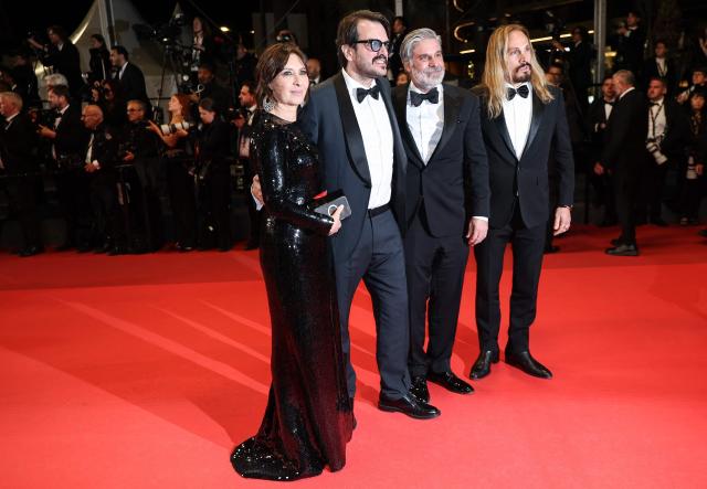 (From L) US producer Raffaella Leone, Brazilian producer Rodrigo Teixeira, US film producer Anthony Katagas leave after the screening of the film "Paper Tiger" at the 79th edition of the Cannes Film Festival in Cannes, southern France on May 16, 2026. (Photo by Sameer AL-DOUMY / AFP)