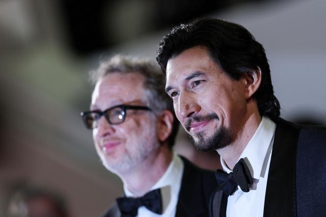US director James Gray and US actor Adam Driver leave after the screening of the film "Paper Tiger" at the 79th edition of the Cannes Film Festival in Cannes, southern France on May 16, 2026. (Photo by Sameer AL-DOUMY / AFP)