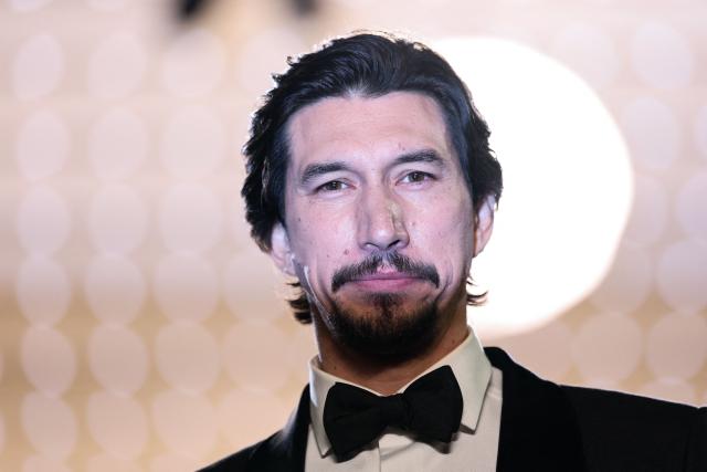 US actor Adam Driver leaves after the screening of the film "Paper Tiger" at the 79th edition of the Cannes Film Festival in Cannes, southern France on May 16, 2026. (Photo by Sameer AL-DOUMY / AFP)