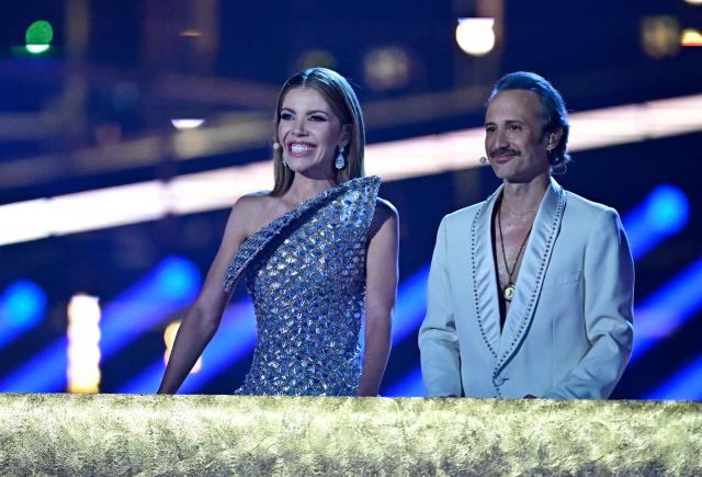 Austrian presenters Victoria Swarovski and Michael Ostrowski address the audience during the voting of the final of the Eurovision Song Contest 2026 (ESC) at Wiener Stadthalle in Vienna, Austria on May 16, 2026. (Photo by Tobias SCHWARZ / AFP)