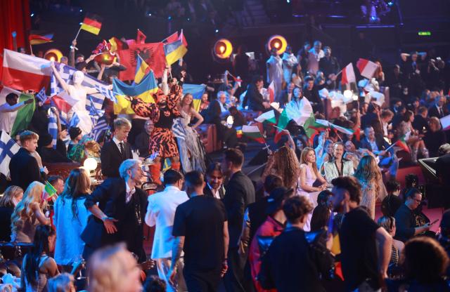 Austrian presenters Victoria Swarovski and Michael Ostrowski sit in the artist's zone during the final of the Eurovision Song Contest 2026 (ESC) at Wiener Stadthalle in Vienna, Austria on May 16, 2026. (Photo by Radek MICA / AFP)