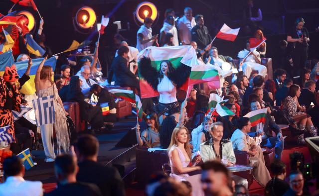 Austrian presenters Victoria Swarovski and Michael Ostrowski sit in the artist's zone during the final of the Eurovision Song Contest 2026 (ESC) at Wiener Stadthalle in Vienna, Austria on May 16, 2026. (Photo by Radek MICA / AFP)