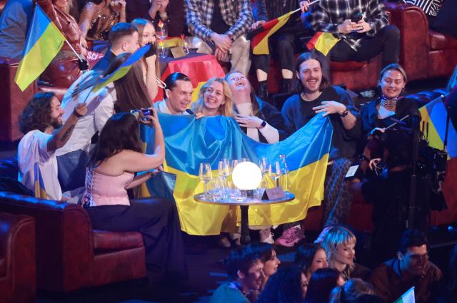 Supporters of Ukraine celebrate in the artist's zone during the final of the Eurovision Song Contest 2026 (ESC) at Wiener Stadthalle in Vienna, Austria on May 16, 2026. (Photo by Radek MICA / AFP)