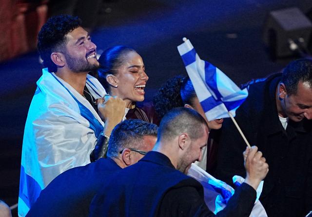 Israel's Noam Bettan (L) reacts during the final of the Eurovision Song Contest 2026 (ESC) at Wiener Stadthalle in Vienna, Austria on May 16, 2026. (Photo by GEORG HOCHMUTH / APA / AFP) / Austria OUT