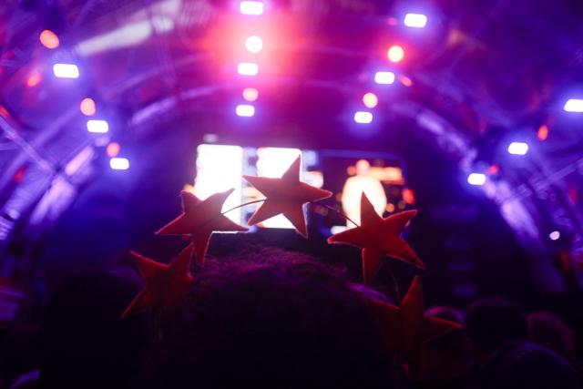 A spectator wears European stars at the fan area to watch the final of the Eurovision Song Contest 2026 (ESC) outside the City Hall in Vienna, Austria on May 16, 2026. (Photo by Alex HALADA / AFP)