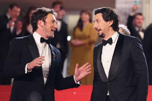 US actor Miles Teller and US actor Adam Driver leave after the screening of the film "Paper Tiger" at the 79th edition of the Cannes Film Festival in Cannes, southern France on May 16, 2026. (Photo by Thibaud MORITZ / AFP)