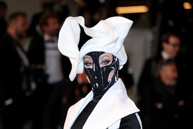 A guest arrives for the screening of the film "Full Phil" at the 79th edition of the Cannes Film Festival in Cannes, southern France on May 16, 2026. (Photo by Sameer AL-DOUMY / AFP)