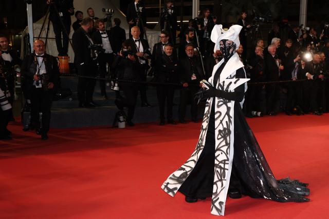 A guest arrives for the screening of the film "Full Phil" at the 79th edition of the Cannes Film Festival in Cannes, southern France on May 16, 2026. (Photo by Sameer AL-DOUMY / AFP)