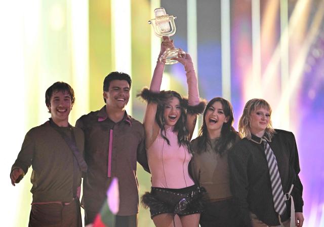 Winner Darina Nikolaeva Yotova, aka Dara and representing Bulgaria with the song 'Bangaranga' (C), celebrates with the trophy after the final of the Eurovision Song Contest 2026 (ESC) at Wiener Stadthalle in Vienna, Austria on May 16, 2026. (Photo by Tobias SCHWARZ / AFP)