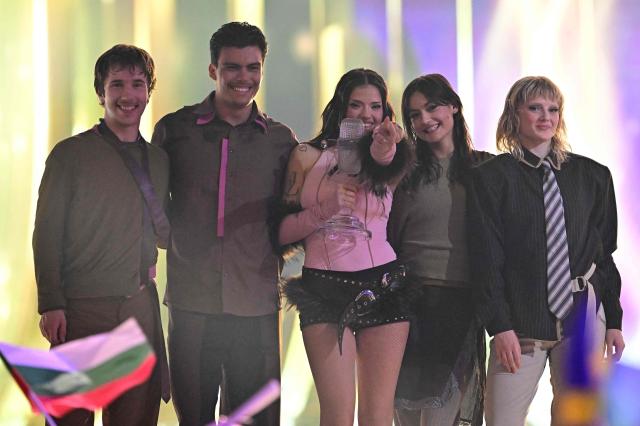 Winner Darina Nikolaeva Yotova, aka Dara and representing Bulgaria with the song 'Bangaranga' (C), celebrates with the trophy after the final of the Eurovision Song Contest 2026 (ESC) at Wiener Stadthalle in Vienna, Austria on May 16, 2026. (Photo by Tobias SCHWARZ / AFP)