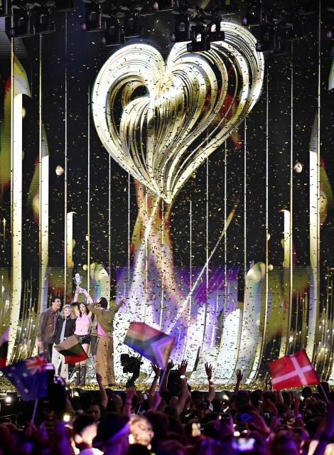 Winner Darina Nikolaeva Yotova, aka Dara and representing Bulgaria with the song 'Bangaranga' (C) celebrates with the trophy after the final of the Eurovision Song Contest 2026 (ESC) at Wiener Stadthalle in Vienna, Austria on May 16, 2026. (Photo by Tobias SCHWARZ / AFP)