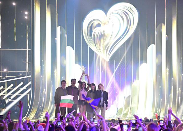 Winner Darina Nikolaeva Yotova, aka Dara and representing Bulgaria with the song 'Bangaranga' (C), celebrates with the trophy after the final of the Eurovision Song Contest 2026 (ESC) at Wiener Stadthalle in Vienna, Austria on May 16, 2026. (Photo by Tobias SCHWARZ / AFP)