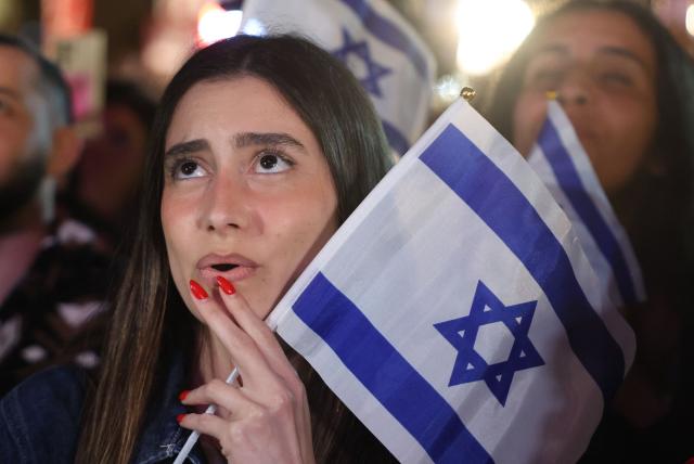 A woman reacts as people gather at the Tel Aviv 360, a giant beachfront stage in Tel Aviv on May 16, 2026, to watch the final of the Eurovision Song Contest 2026 (ESC) being held at the Wiener Stadthalle in Vienna, Austria. (Photo by Jack GUEZ / AFP)