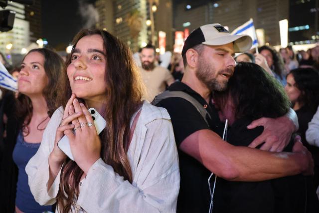 A woman reacts as people gather at the Tel Aviv 360, a giant beachfront stage in Tel Aviv on May 16, 2026, to watch the final of the Eurovision Song Contest 2026 (ESC) being held at the Wiener Stadthalle in Vienna, Austria. (Photo by Jack GUEZ / AFP)