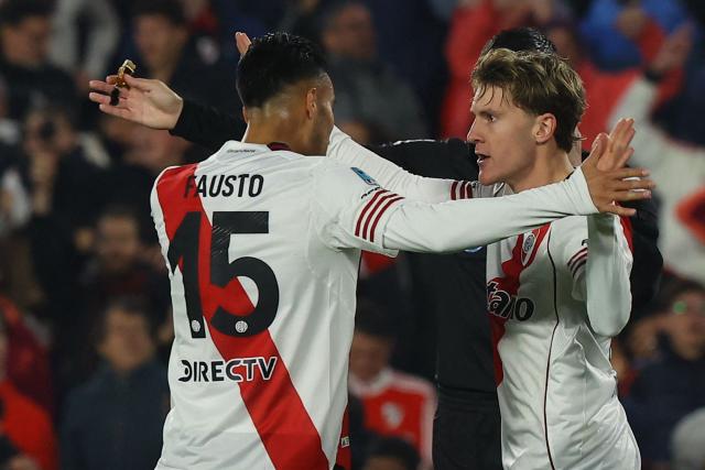 River Plate's forward #11 Facundo Colidio celebrates after scoring his team first goal with midfielder #15 Fausto Veraduring the Argentine Professional Football League Apertura tournament semifinal between River Plate and Rosario Central at MAS Monumental Stadium in Buenos Aires on May 16, 2026. (Photo by Alejandro PAGNI / AFP)