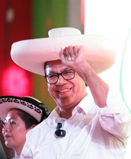 Peru's presidential candidate Roberto Sanchez, of the Juntos por el Peru party, gestures to supporters during a campaign rally in Lima on May 16, 2026. Left-wing candidate Roberto Sanchez has qualified for the runoff of Peru's presidential election and will face right-wing candidate Keiko Fujimori in June 7. (Photo by Connie FRANCE / AFP)