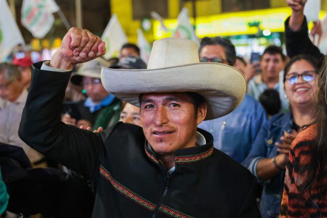A supporters of Peru’s presidential candidate Roberto Sanchez, of the Juntos por el Peru party, takes part in a rally in Lima on May 16, 2026. Left-wing candidate Roberto Sanchez has qualified for the runoff of Peru's presidential election and will face right-wing candidate Keiko Fujimori in June. (Photo by Connie FRANCE / AFP)