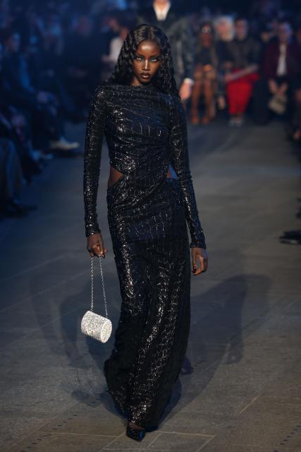 A model walks the runway during the Gucci Cruise 2027 collection fashion show at Times Square in New York on May 16, 2026. (Photo by ANGELA WEISS / AFP)