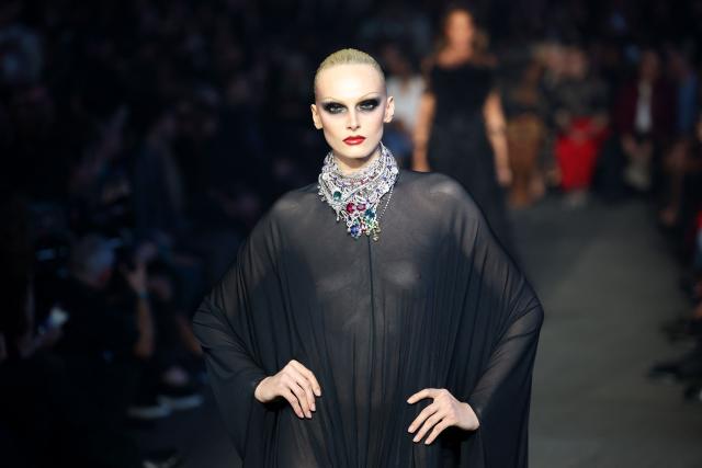A model walks the runway during the Gucci Cruise 2027 collection fashion show at Times Square in New York on May 16, 2026. (Photo by ANGELA WEISS / AFP)