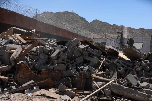 Municipal workers demolish unauthorized dwellings at the Mexico-US border wall in Puerto Anapra neighborhood, Ciudad Juarez, Chihuahua state, Mexico on May 16, 2026. (Photo by Herika Martinez / AFP)