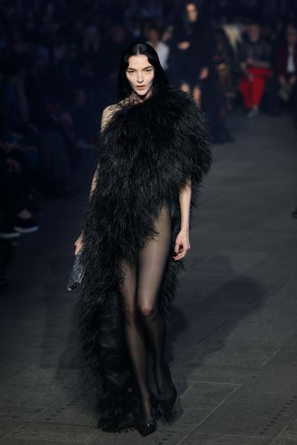 Italian model Mariacarla Boscono walks the runway during the Gucci Cruise 2027 collection fashion show at Times Square in New York on May 16, 2026. (Photo by ANGELA WEISS / AFP)