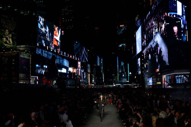 A model walks the runway during the Gucci Cruise 2027 collection fashion show at Times Square in New York on May 16, 2026. (Photo by ANGELA WEISS / AFP)