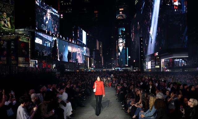 A model walks the runway during the Gucci Cruise 2027 collection fashion show at Times Square in New York on May 16, 2026. (Photo by ANGELA WEISS / AFP)