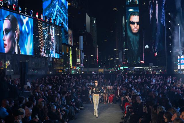 A model walks the runway during the Gucci Cruise 2027 collection fashion show at Times Square in New York on May 16, 2026. (Photo by ANGELA WEISS / AFP)