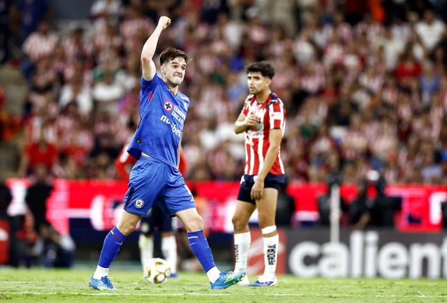Cruz Azul's Argentine midfielder #08 Agustin Palavecino celebrates after scoring his team's second goal during the Liga MX Clausura semifinal second-leg football match between Guadalajara and Cruz Azul at Jalisco stadium in Guadalajara, Jalisco state, Mexico on May 16, 2026. (Photo by Ulises Ruiz / AFP)