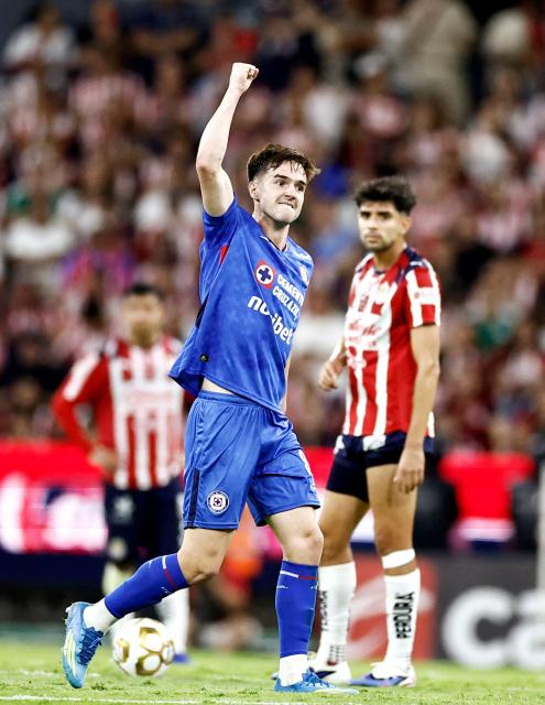 Cruz Azul's Argentine midfielder #08 Agustin Palavecino celebrates after scoring his team's second goal during the Liga MX Clausura semifinal second-leg football match between Guadalajara and Cruz Azul at Jalisco stadium in Guadalajara, Jalisco state, Mexico on May 16, 2026. (Photo by Ulises Ruiz / AFP)