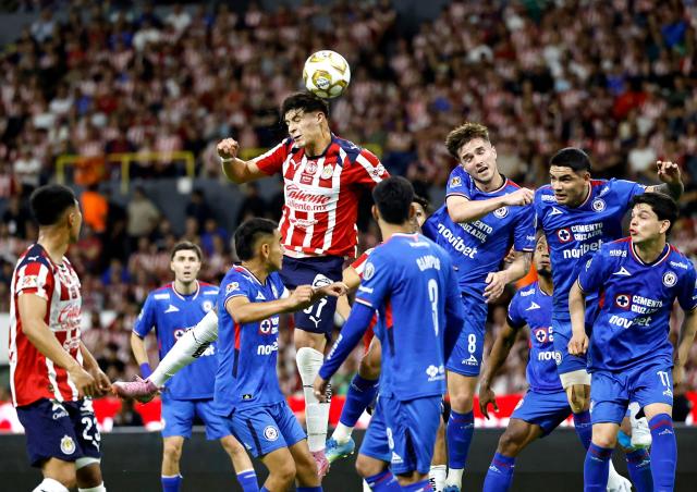 Guadalajara's US defender #37 Richard Ledezma heads the ball during the Liga MX Clausura semifinal second-leg football match between Guadalajara and Cruz Azul at Jalisco stadium in Guadalajara, Jalisco state, Mexico on May 16, 2026. (Photo by ULISES RUIZ / AFP)
