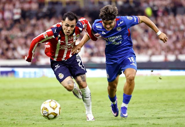 Guadalajara's forward #26 Hugo Camberos and Cruz Azul's forward #18 Luka Romero fight for the ball during the Liga MX Clausura semifinal second-leg football match between Guadalajara and Cruz Azul at Jalisco stadium in Guadalajara, Jalisco state, Mexico on May 16, 2026. (Photo by ULISES RUIZ / AFP)