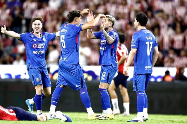 Cruz Azul players celebrate after winning the Liga MX Clausura semifinal second-leg football match between Guadalajara and Cruz Azul at Jalisco stadium in Guadalajara, Jalisco state, Mexico on May 16, 2026. (Photo by Ulises Ruiz / AFP)
