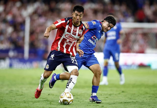 Guadalajara's US midfielder #23 Daniel Aguirre and Cruz Azul's forward #18 Luka Romero fight for the ball during the Liga MX Clausura semifinal second-leg football match between Guadalajara and Cruz Azul at Jalisco stadium in Guadalajara, Jalisco state, Mexico on May 16, 2026. (Photo by Ulises Ruiz / AFP)