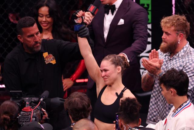 US Mixed Martial Arts (MMA) fighter Ronda Rousey celebrates after defeating Gina Carano during their Featherweight Bout at the Intuit Dome in Inglewood, California, on May 16, 2026. (Photo by Patrick T. Fallon / AFP)