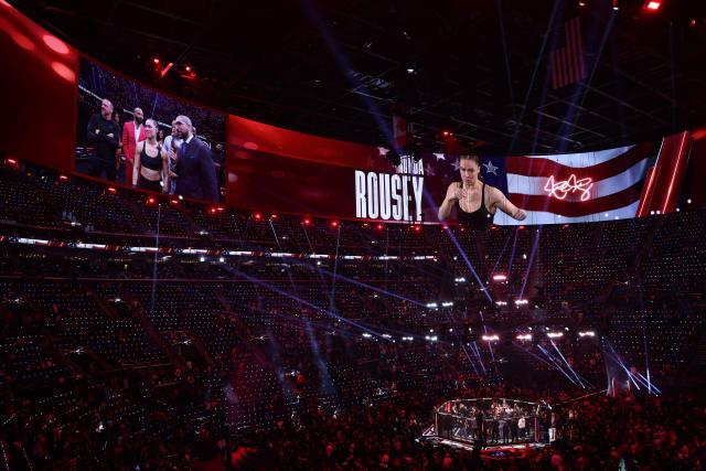 US Mixed Martial Arts (MMA) fighter Ronda Rousey is interviewed after defeating Gina Carano during their Featherweight Bout at the Intuit Dome in Inglewood, California, on May 16, 2026. (Photo by Patrick T. Fallon / AFP)