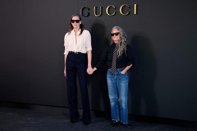 US fashion designer Jenna Lyons (L) and US photographer Cass Bird attend the Gucci Cruise 2027 collection fashion show at Times Square in New York on May 16, 2026. (Photo by Leonardo MUNOZ / AFP)