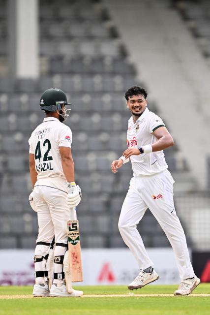 Bangladesh’s Taskin Ahmed (R) celebrates after taking the wicket of Pakistan’s Abdullah Fazal during the second day of the second Test cricket match between Bangladesh and Pakistan at the Sylhet International Cricket Stadium in Sylhet on May 17, 2026. (Photo by MUNIR UZ ZAMAN / AFP)