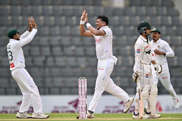 Bangladesh’s Taskin Ahmed (2L) celebrates with Mehidy Hasan Miraz (L) after taking the wicket of Pakistan’s Azan Awais during the second day of the second Test cricket match between Bangladesh and Pakistan at the Sylhet International Cricket Stadium in Sylhet on May 17, 2026. (Photo by Munir UZ ZAMAN / AFP)