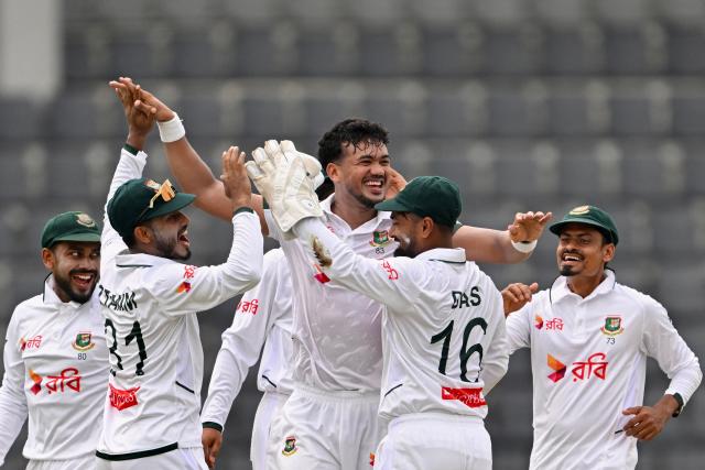 Bangladesh’s Taskin Ahmed (C) celebrates with teammates after taking the wicket of Pakistan’s Azan Awais during the second day of the second Test cricket match between Bangladesh and Pakistan at the Sylhet International Cricket Stadium in Sylhet on May 17, 2026. (Photo by Munir UZ ZAMAN / AFP)