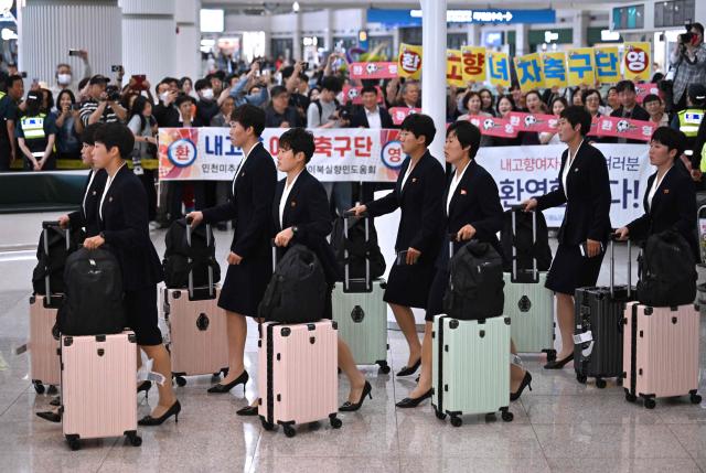 North Korea's Naegohyang Women's FC players arrive at Incheon International Airport in Incheon on May 17, 2026, ahead of the Women's Asian Champions League semi-final football match against South Korea's Suwon FC Women. A North Korean women's football team arrived in South Korea on May 17, marking the first visit by a sports team from the isolated country to its southern neighbour in eight years, to play in the Asian Champions League semi-finals. (Photo by Jung Yeon-je / AFP)