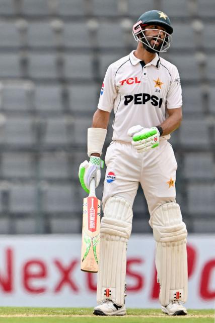 Pakistan’s captain Shan Masood reacts after his dismissal during the second day of the second Test cricket match between Bangladesh and Pakistan at the Sylhet International Cricket Stadium in Sylhet on May 17, 2026. (Photo by Munir UZ ZAMAN / AFP)
