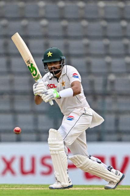 Pakistan’s Babar Azam plays a shot during the second day of the second Test cricket match between Bangladesh and Pakistan at the Sylhet International Cricket Stadium in Sylhet on May 17, 2026. (Photo by Munir UZ ZAMAN / AFP)