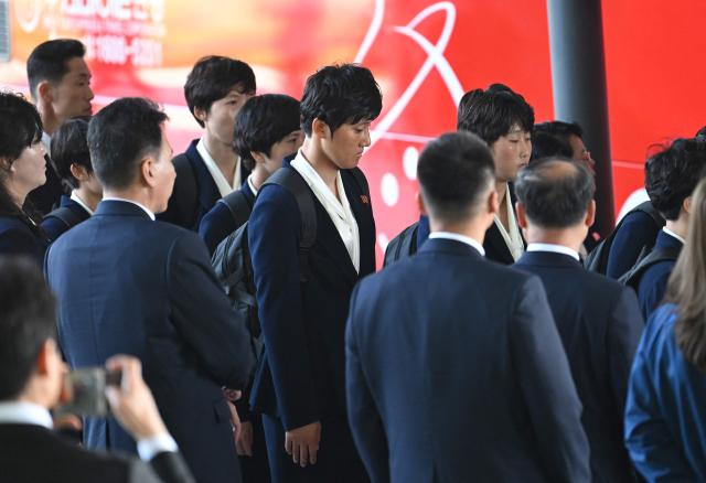 North Korea's Naegohyang Women's FC players get on a bus upon their arrival at Incheon International Airport in Incheon on May 17, 2026, ahead of the Women's Asian Champions League semi-final football match against South Korea's Suwon FC Women. A North Korean women's football team arrived in South Korea on May 17, marking the first visit by a sports team from the isolated country to its southern neighbour in eight years, to play in the Asian Champions League semi-finals. (Photo by Jung Yeon-je / AFP)