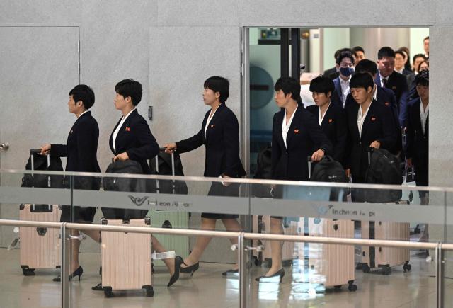 North Korea's Naegohyang Women's FC players arrive at Incheon International Airport in Incheon on May 17, 2026, ahead of the Women's Asian Champions League semi-final football match against South Korea's Suwon FC Women. A North Korean women's football team arrived in South Korea on May 17, marking the first visit by a sports team from the isolated country to its southern neighbour in eight years, to play in the Asian Champions League semi-finals. (Photo by Jung Yeon-je / AFP)