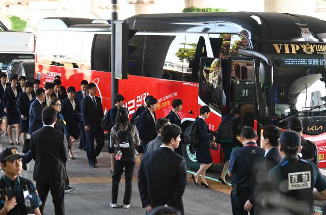 North Korea's Naegohyang Women's FC players get on a bus upon their arrival at Incheon International Airport in Incheon on May 17, 2026, ahead of the Women's Asian Champions League semi-final football match against South Korea's Suwon FC Women. A North Korean women's football team arrived in South Korea on May 17, marking the first visit by a sports team from the isolated country to its southern neighbour in eight years, to play in the Asian Champions League semi-finals. (Photo by Jung Yeon-je / AFP)