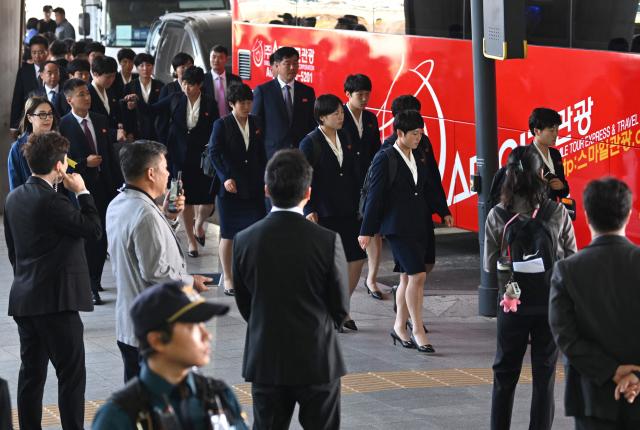 North Korea's Naegohyang Women's FC players get on a bus upon their arrival at Incheon International Airport in Incheon on May 17, 2026, ahead of the Women's Asian Champions League semi-final football match against South Korea's Suwon FC Women. A North Korean women's football team arrived in South Korea on May 17, marking the first visit by a sports team from the isolated country to its southern neighbour in eight years, to play in the Asian Champions League semi-finals. (Photo by Jung Yeon-je / AFP)