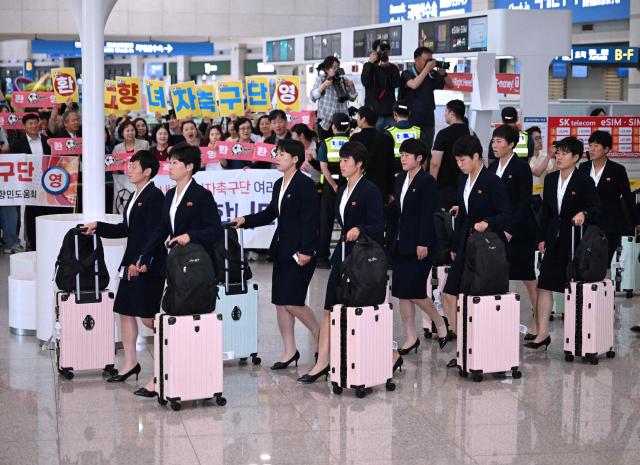 North Korea's Naegohyang Women's FC players arrive at Incheon International Airport in Incheon on May 17, 2026, ahead of the Women's Asian Champions League semi-final football match against South Korea's Suwon FC Women. A North Korean women's football team arrived in South Korea on May 17, marking the first visit by a sports team from the isolated country to its southern neighbour in eight years, to play in the Asian Champions League semi-finals. (Photo by Jung Yeon-je / AFP)