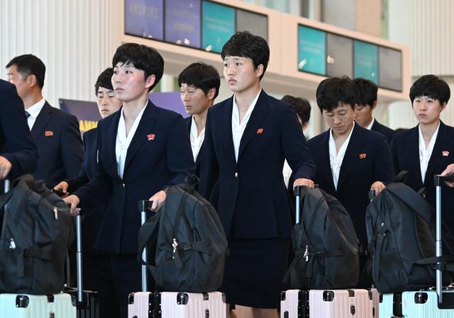 North Korea's Naegohyang Women's FC players arrive at Incheon International Airport in Incheon on May 17, 2026, ahead of the Women's Asian Champions League semi-final football match against South Korea's Suwon FC Women. A North Korean women's football team arrived in South Korea on May 17, marking the first visit by a sports team from the isolated country to its southern neighbour in eight years, to play in the Asian Champions League semi-finals. (Photo by Jung Yeon-je / AFP)